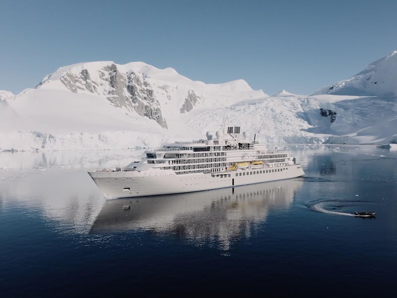 Silver Endeavour — Silversea luxury expedition ship in Antarctica with mountain reflection